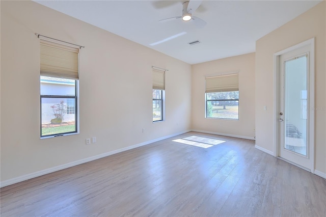 unfurnished room with ceiling fan and light wood-type flooring