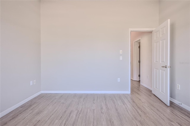 spare room featuring light wood-type flooring