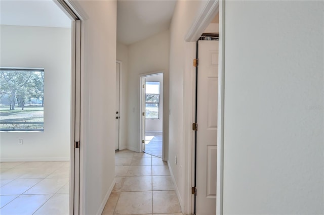 hall featuring light tile patterned floors