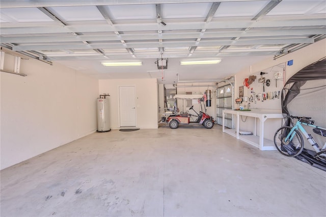 garage with a garage door opener and electric water heater