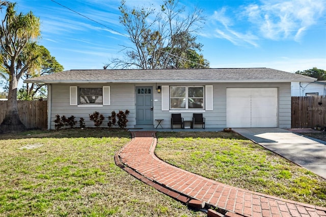 ranch-style house with driveway, an attached garage, fence, and a front yard