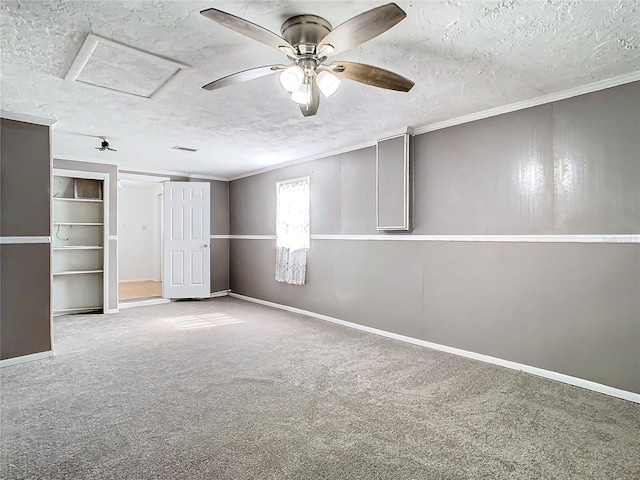 unfurnished bedroom featuring crown molding, carpet floors, and a textured ceiling