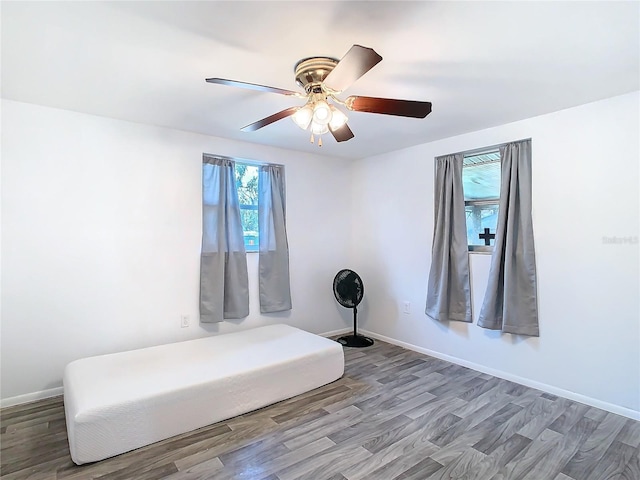 unfurnished room featuring hardwood / wood-style flooring and ceiling fan