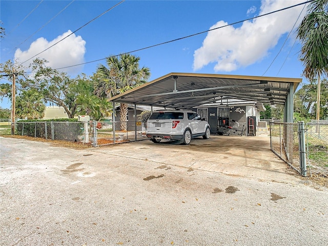 view of vehicle parking with a carport