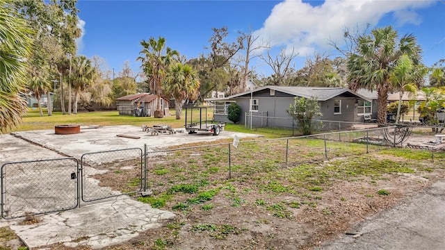 view of yard featuring a fire pit and a patio area