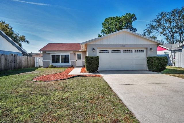 single story home with a garage and a front lawn