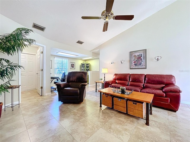 living room with lofted ceiling, light tile patterned floors, baseboards, and visible vents