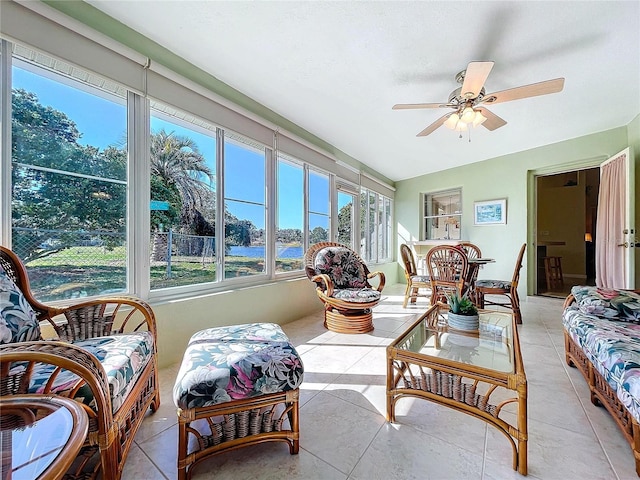 sunroom / solarium featuring ceiling fan