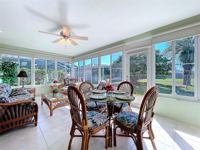 sunroom with a ceiling fan