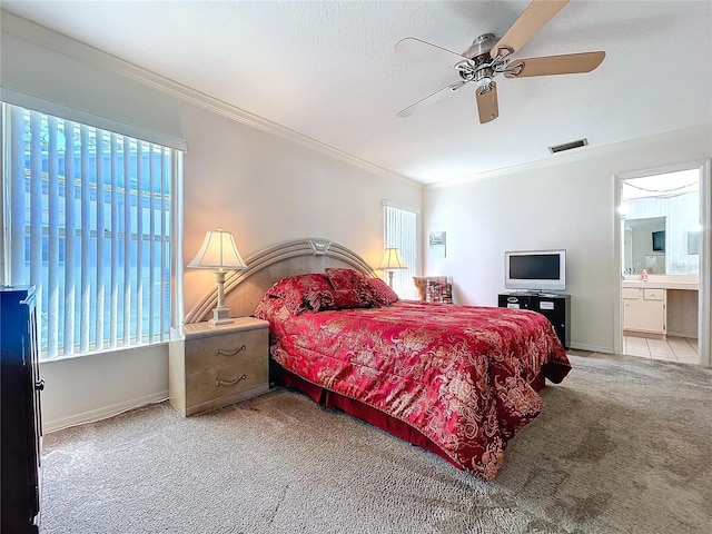 bedroom featuring carpet, visible vents, crown molding, and multiple windows