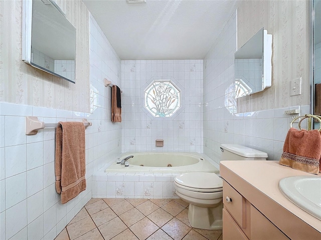 full bathroom with wallpapered walls, toilet, tile patterned floors, a whirlpool tub, and tile walls