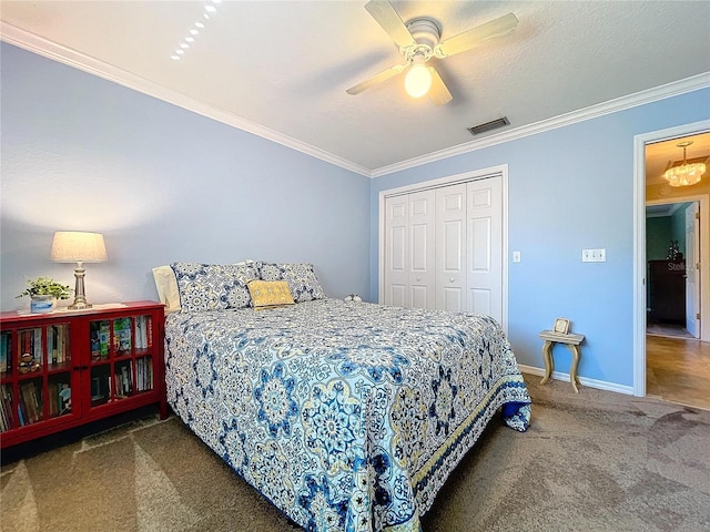 carpeted bedroom with ornamental molding, a closet, visible vents, and baseboards