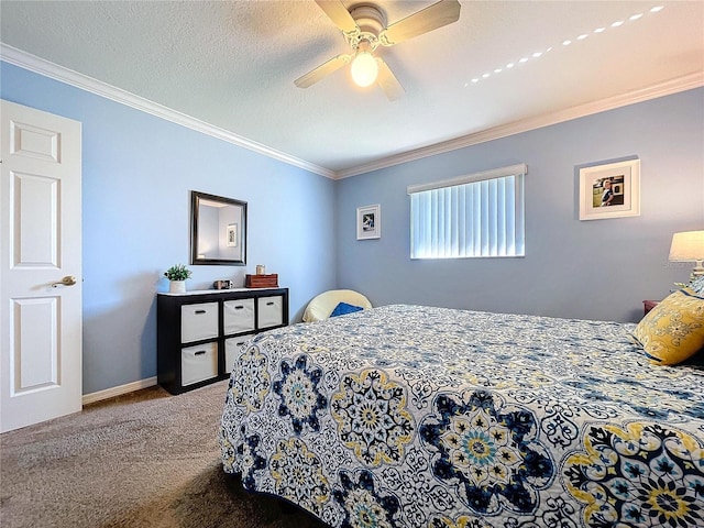 carpeted bedroom featuring baseboards, a textured ceiling, a ceiling fan, and crown molding