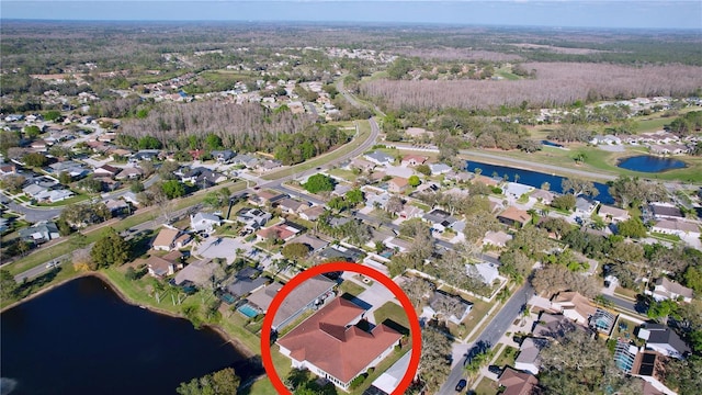 birds eye view of property featuring a residential view and a water view