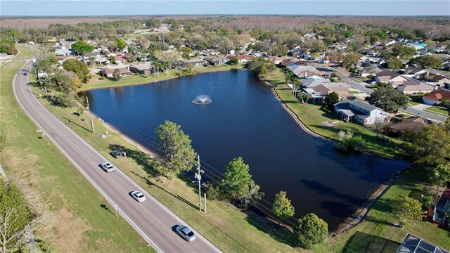 birds eye view of property featuring a water view and a residential view