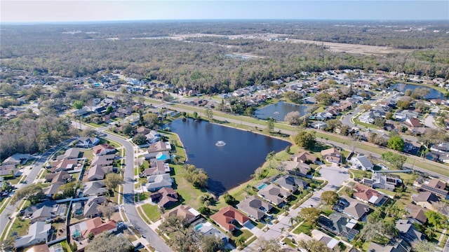 birds eye view of property featuring a water view and a residential view