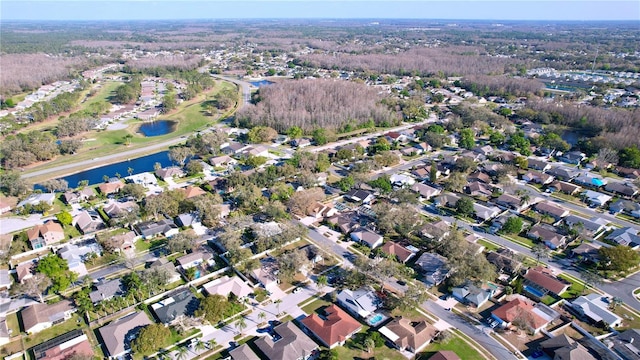 drone / aerial view with a residential view and a water view