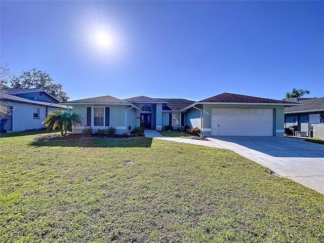 ranch-style home featuring concrete driveway, an attached garage, a front lawn, and stucco siding