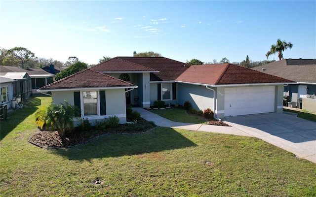 ranch-style house featuring an attached garage, a front yard, concrete driveway, and stucco siding