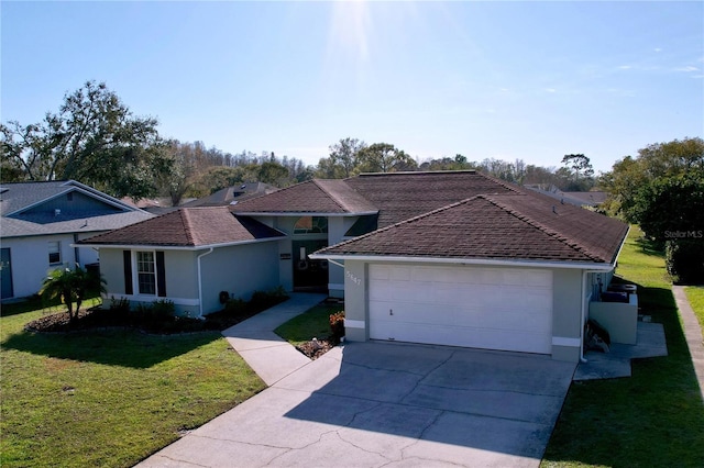 ranch-style home featuring an attached garage, driveway, a front lawn, and stucco siding