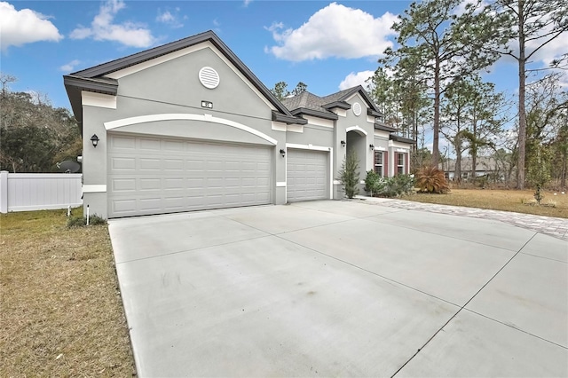 view of front of property with a garage