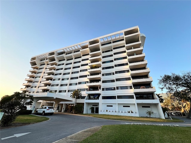 view of outdoor building at dusk