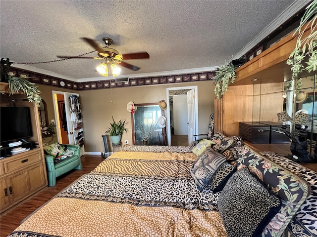 bedroom with crown molding, ceiling fan, a textured ceiling, and hardwood / wood-style flooring