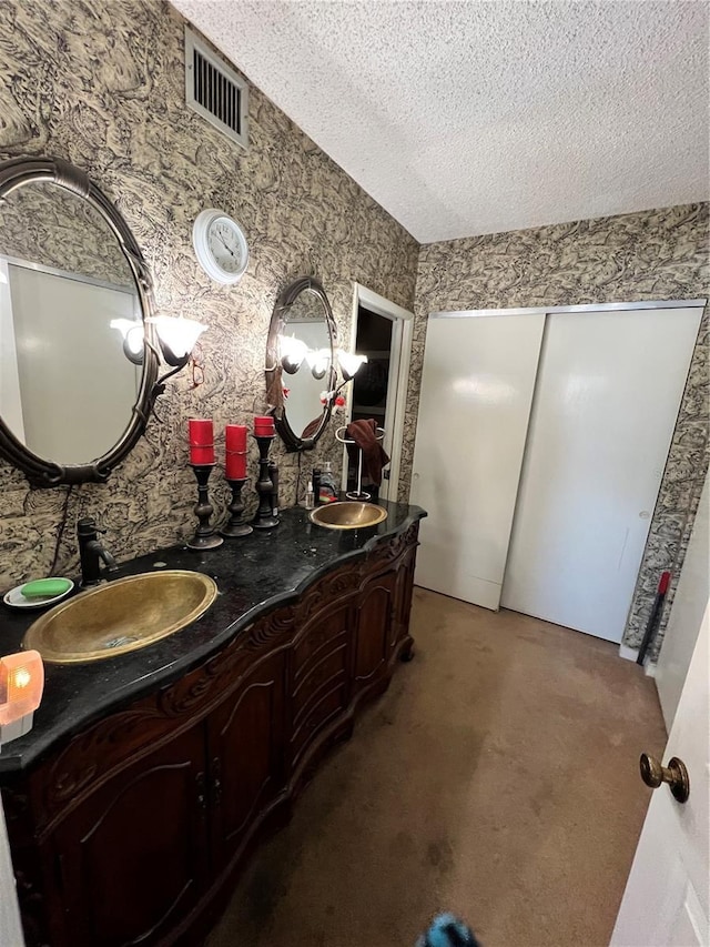 bathroom featuring vanity and a textured ceiling