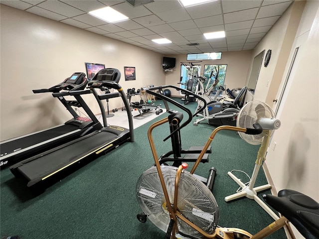 workout area with a paneled ceiling