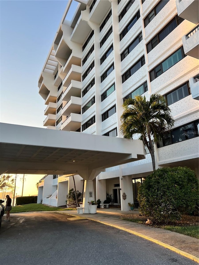 view of outdoor building at dusk