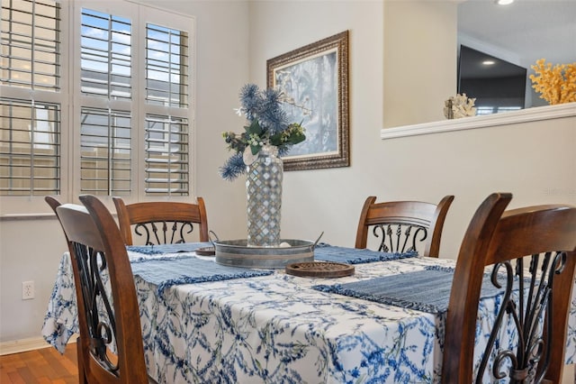 18819 Sunterra Dr, Land O Lakes, FL 34638 - dining space with wood finished floors, recessed lighting, and baseboards