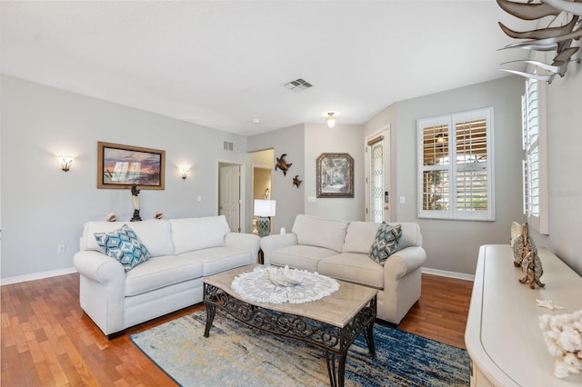 18819 Sunterra Dr, Land O Lakes, FL 34638 - living room featuring wood finished floors and baseboards