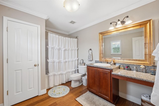 18819 Sunterra Dr, Land O Lakes, FL 34638 - bathroom with vanity, shower / tub combo with curtain, wood finished floors, crown molding, and toilet
