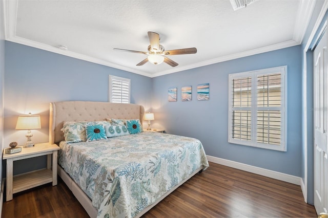 18819 Sunterra Dr, Land O Lakes, FL 34638 - bedroom featuring baseboards, a closet, dark wood-style flooring, crown molding, and a ceiling fan