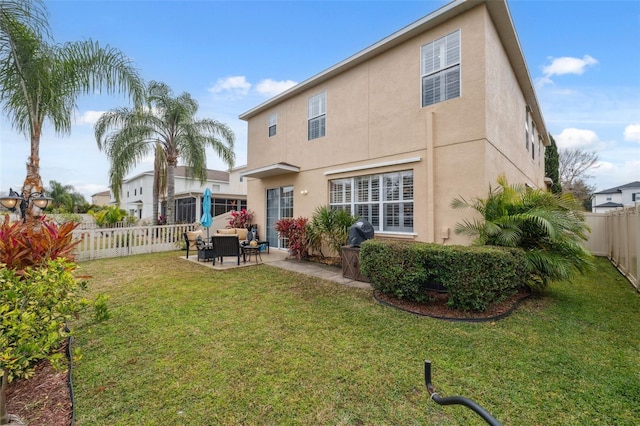 18819 Sunterra Dr, Land O Lakes, FL 34638 - back of house with stucco siding and a patio