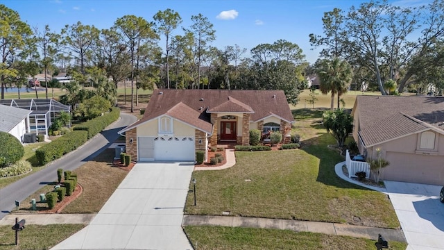 view of front of house featuring a garage and a front yard