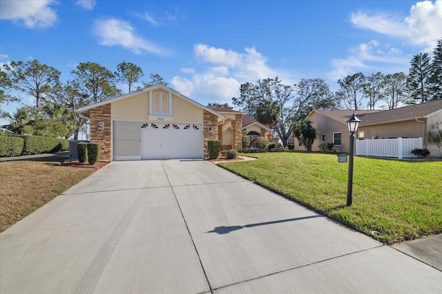 single story home with a garage and a front lawn