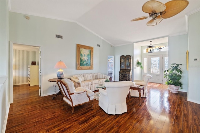 living room featuring ornamental molding, lofted ceiling, dark wood-type flooring, and ceiling fan