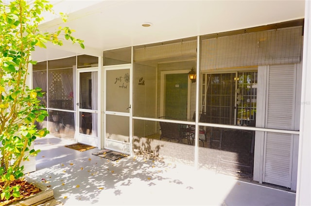 view of patio with a sunroom