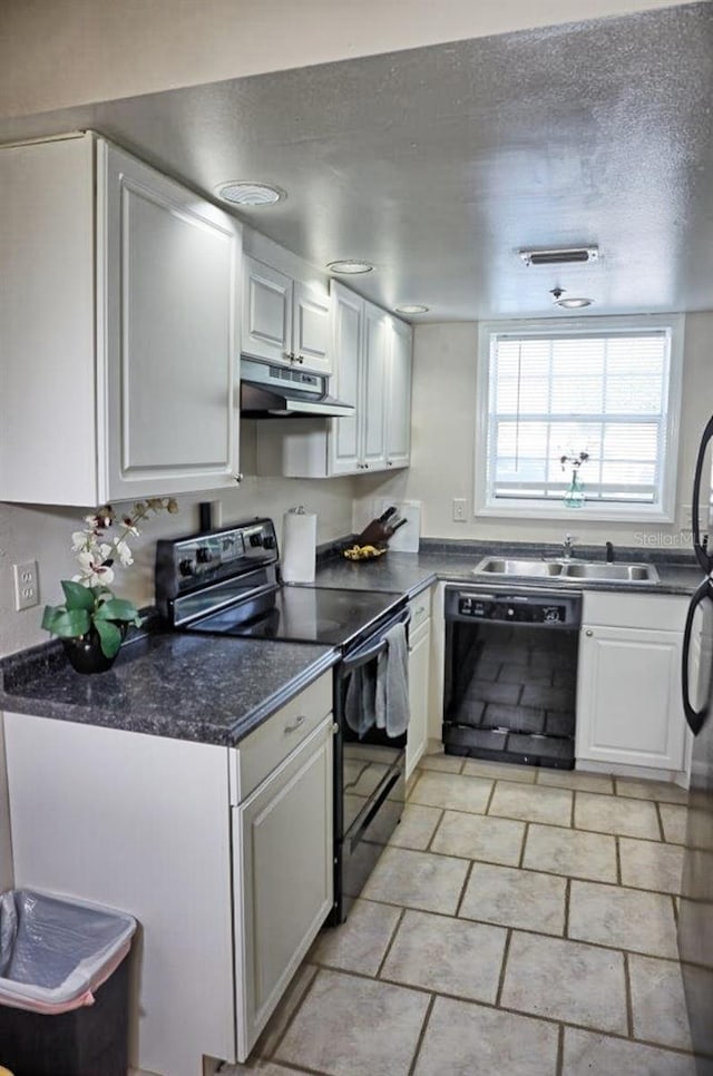 kitchen with sink, a textured ceiling, black appliances, and white cabinets