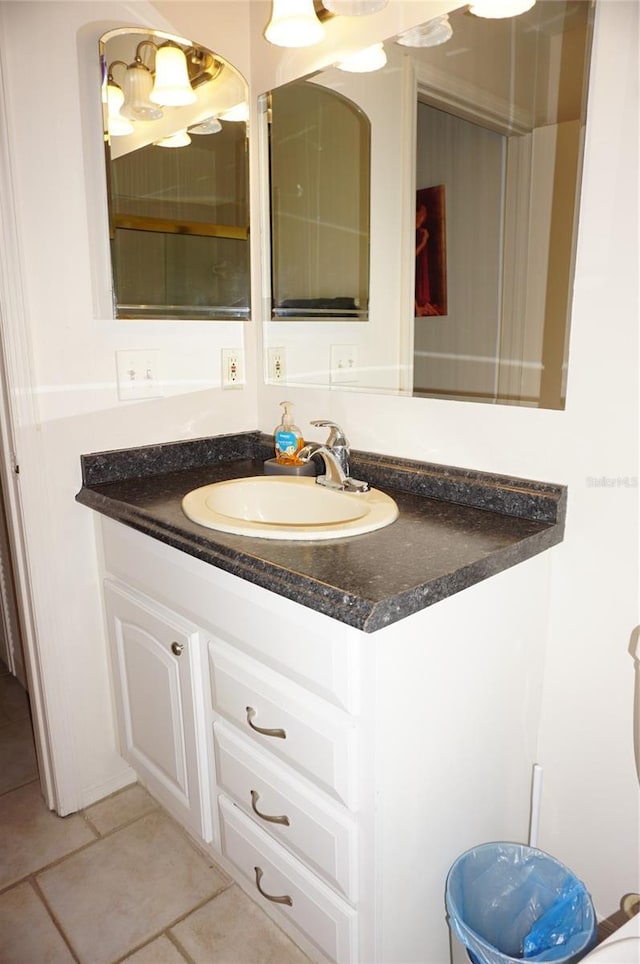 bathroom with tile patterned flooring and vanity