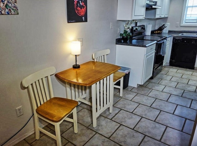 kitchen featuring black appliances, white cabinets, and light tile patterned flooring