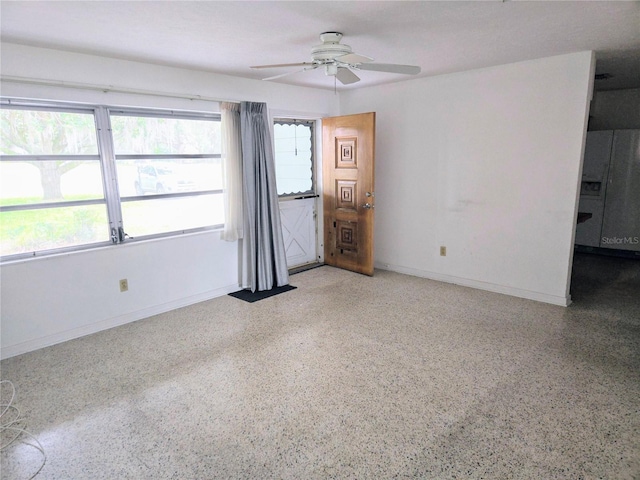 unfurnished room featuring ceiling fan