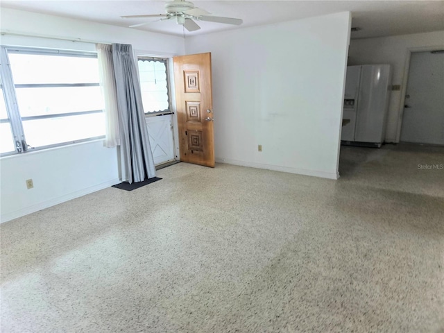 interior space featuring ceiling fan