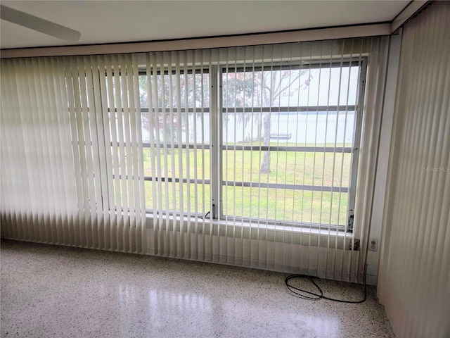 unfurnished sunroom with a water view and plenty of natural light