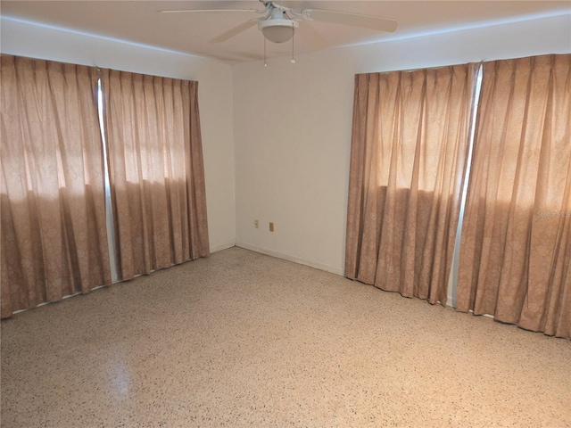 empty room featuring ceiling fan