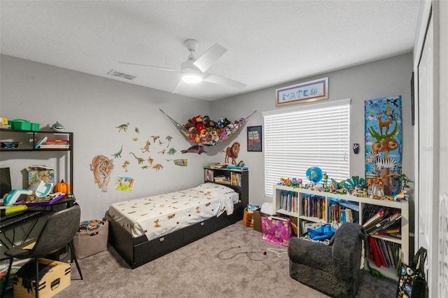 carpeted bedroom with ceiling fan