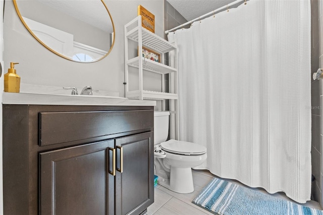 bathroom with walk in shower, tile patterned floors, vanity, and toilet