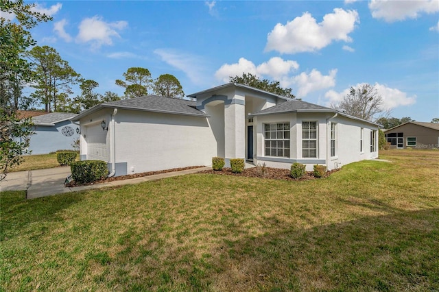 ranch-style house with a garage and a front lawn