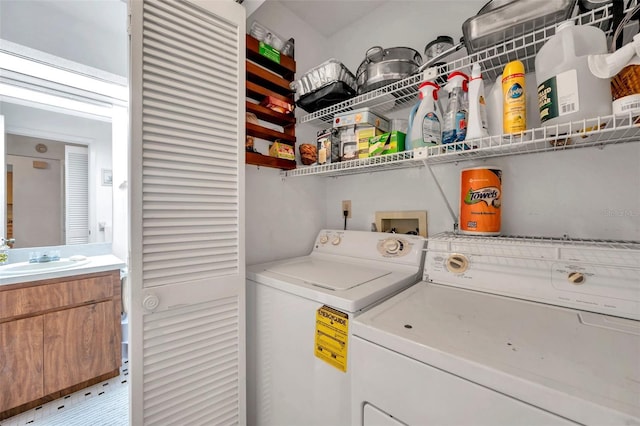 washroom with sink and washing machine and dryer